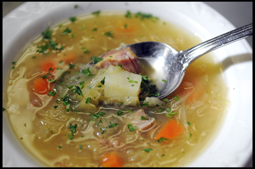 A brothy soup with Sauerkraut, Potatoes, Carrots and Smoked Pork