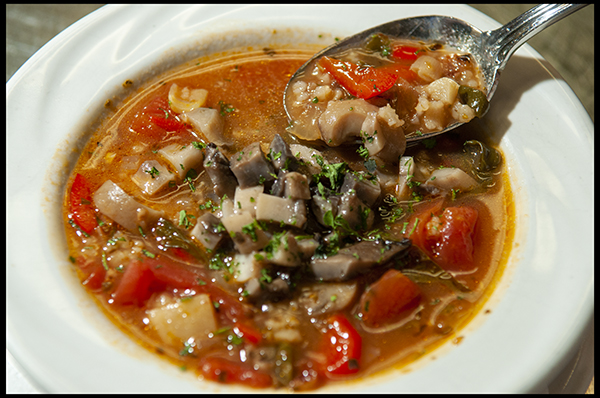 Light Vegan Soup with Wild Rice, Spinach, Peppers, Tomatoes topped with sautéed Portobello Mushrooms and a hint of Thyme.